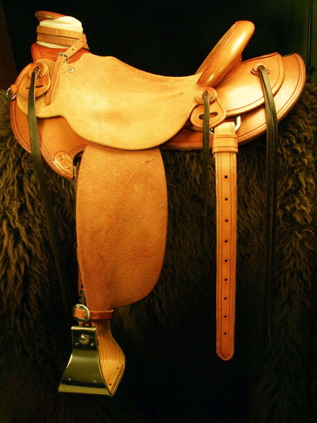 Douglas 38 Wade - tree by Rick Reed, 16 inch seat, Gullet - 7 and 1/2 inch by 6 and 1/4 inch by 4 inch, Horn 4&1/2 inch round, 92 degree bars, 7/8ths flat palte riggin, Cheyenne Roll, Smooth-out half-breed Wade Saddle built by Keith Valley.
